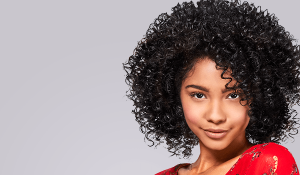 model with dark, curly hair