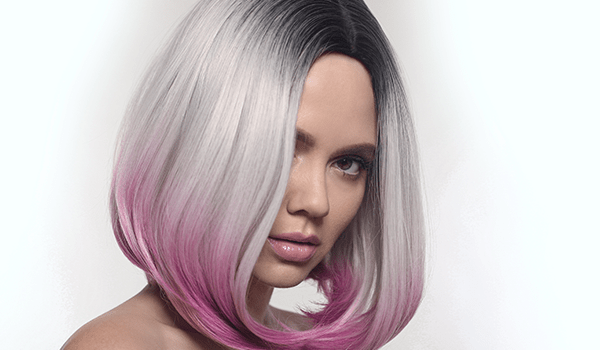 model with dark root faded to silver then pink tips