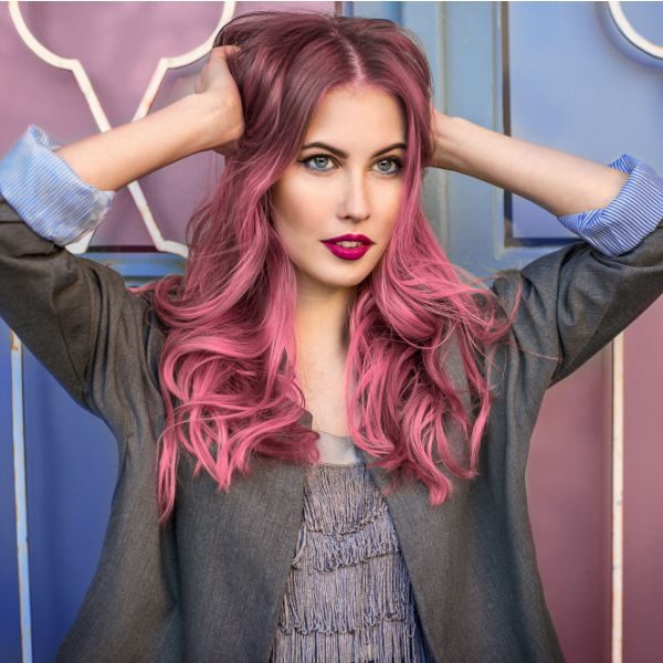 Young woman with bright pink hair