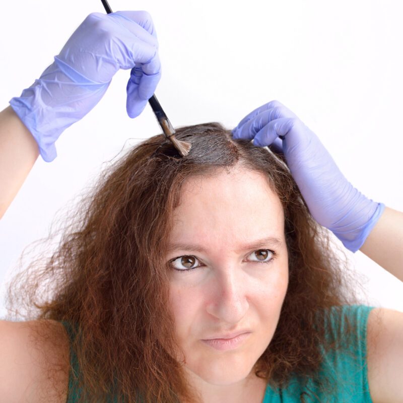 Color correction, woman dying her own hair